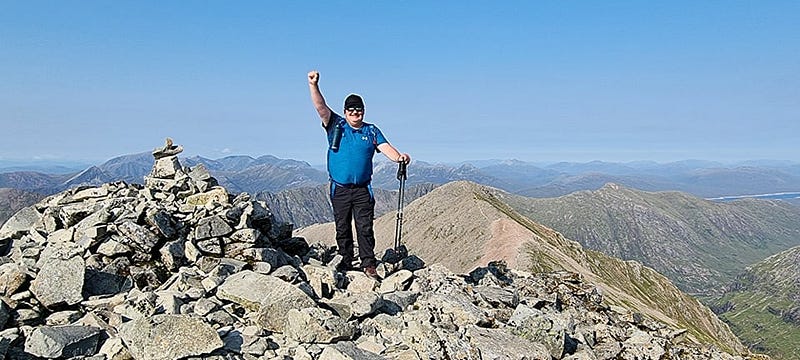 Celebrating my success at the summit of Bidean Nam Bian