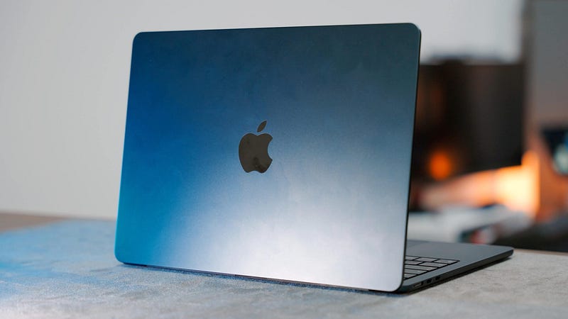 MacBook Air being used for late-night browsing in bed