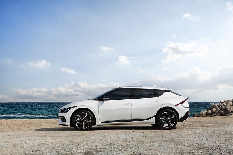 Kia EV6 parked against a scenic backdrop