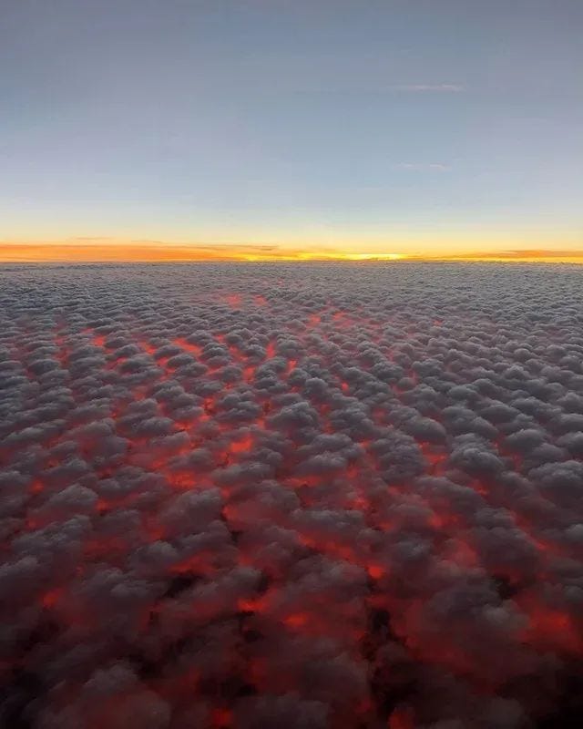 A breathtaking sunset view from above the clouds.