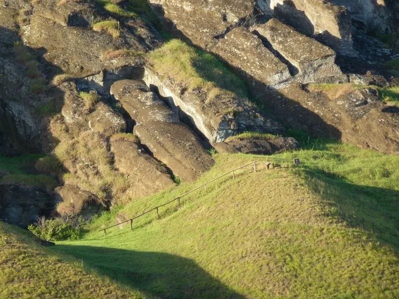 An incomplete Easter Island statue showing the carving process.