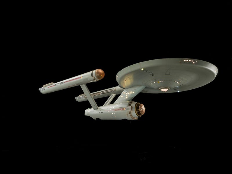 Starship Enterprise navigating through space with advanced technology