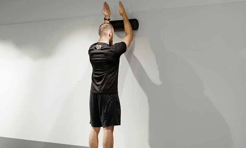 Foam roller wall slide technique