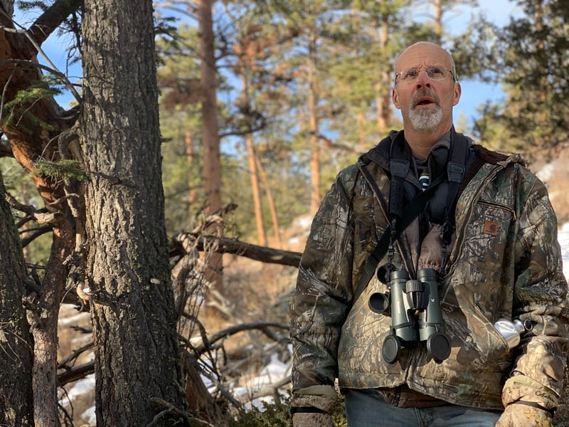 Scott Rashid studying birds in Rocky Mountain National Park