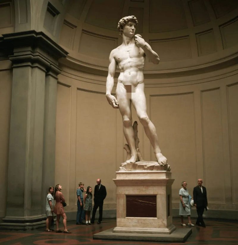 Michelangelo’s sculpture “David” next to a person