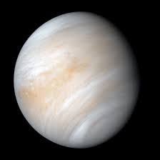 Venus appears similar to a smaller Jupiter due to its dense atmosphere.