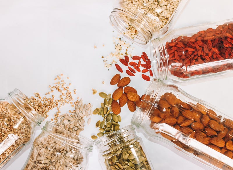 A variety of nuts on a wooden table